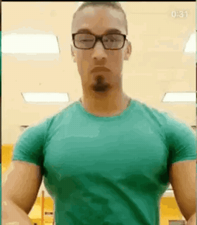 Man In Glasses And Green Shirt Posing GIF