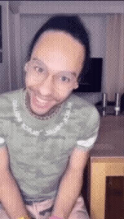 Man In Glasses And Green Shirt Smiling GIF