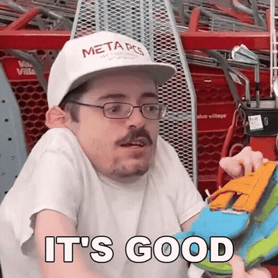 Man In Glasses And Hat Holding Toy Saying It's Good GIF