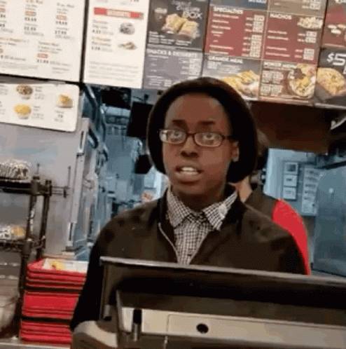 Man In Glasses And Hat In Restaurant GIF
