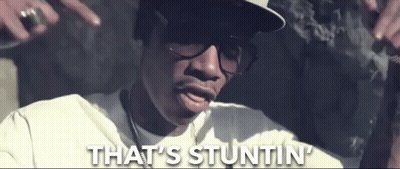 Man In Glasses And Hat Smoking Cigarette Saying That's Stuntin GIF