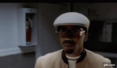 Man In Glasses And Hat Standing In Room GIF