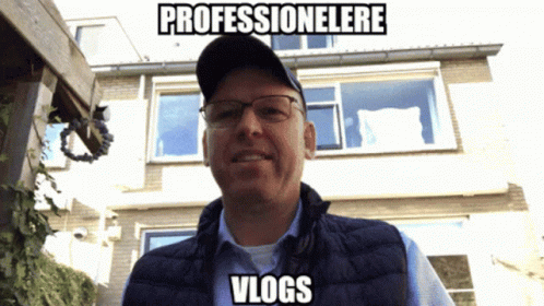 Man In Glasses And Hat With Caption Professionelere Vlogs GIF