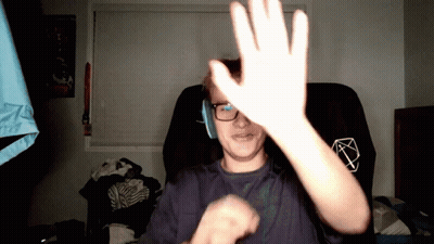 Man In Glasses And Headphones Raises Hand GIF