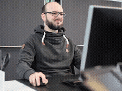 Man In Glasses And Hoodie At Computer GIF