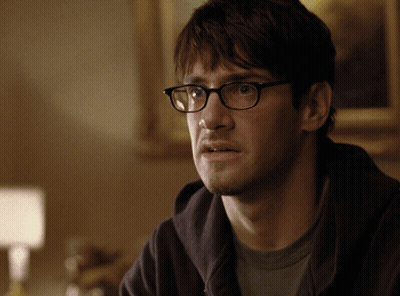 Man In Glasses And Hoodie Looking GIF