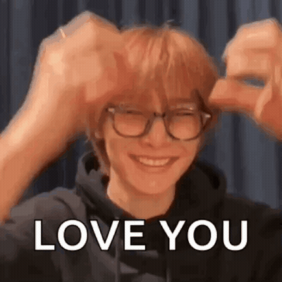 Man In Glasses And Hoodie Making Heart With Hands GIF