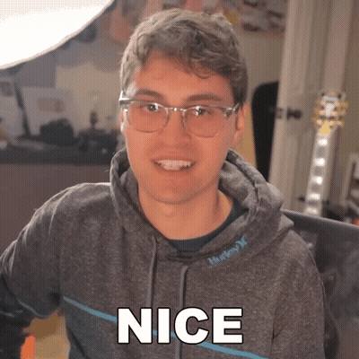 Man In Glasses And Hoodie Saying Nice GIF