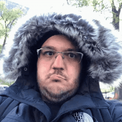 Man In Glasses And North Face Fur Hooded Jacket GIF