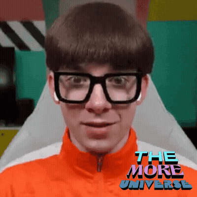 Man In Glasses And Orange Jacket Saying The More Universe GIF