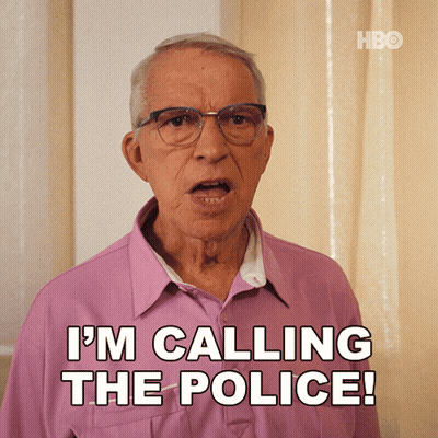 Man In Glasses And Pink Shirt Calling The Police GIF