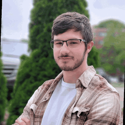 Man In Glasses And Plaid Shirt Smiling GIF