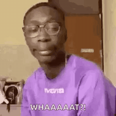 Man In Glasses And Purple Shirt Making A Face GIF