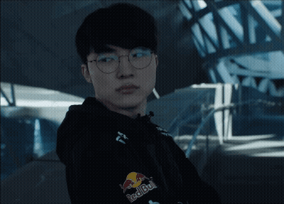 Man In Glasses And Red Bull Jacket Looking At Camera GIF