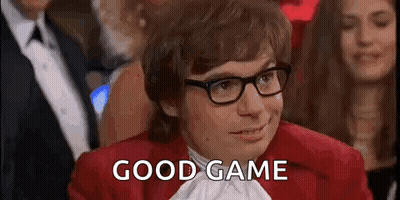 Man In Glasses And Red Jacket Saying Good Game In Crowd GIF