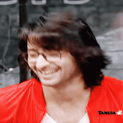 Man In Glasses And Red Jacket With Tanuja GIF