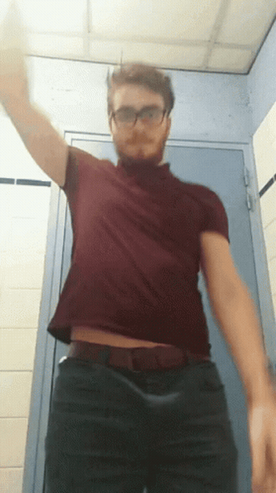 Man In Glasses And Red Shirt In Bathroom GIF