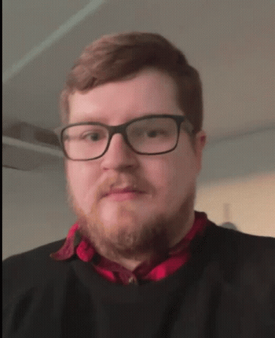 Man In Glasses And Red Shirt Processing GIF