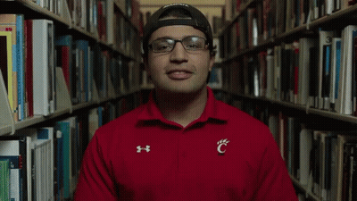 Man In Glasses And Red Shirt With Letter C GIF