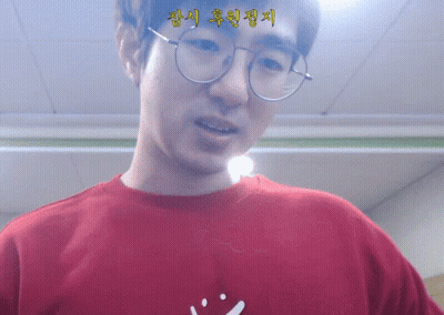Man In Glasses And Red Shirt With Smiley Face GIF