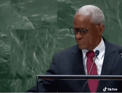 Man In Glasses And Red Tie Giving Speech At Podium GIF