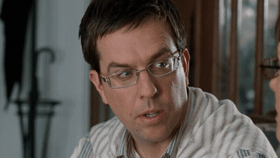 Man In Glasses And Striped Shirt Talking To Another Man GIF