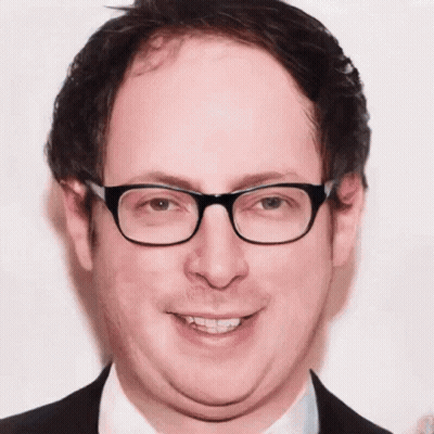 Man In Glasses And Suit Close Up GIF