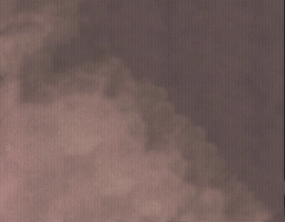 Man In Glasses And Suit Looking At Camera GIF