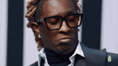 Man In Glasses And Suit Making Funny Face GIF