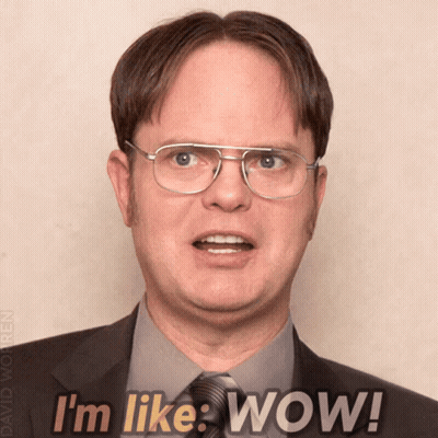 Man In Glasses And Suit Saying Wow GIF