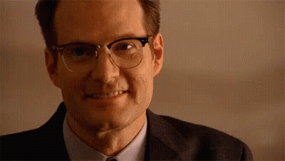 Man In Glasses And Suit Smiling GIF