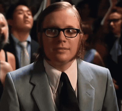Man In Glasses And Suit Standing In Crowd GIF