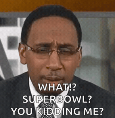 Man in Glasses and Suit Talking About Super Bowl