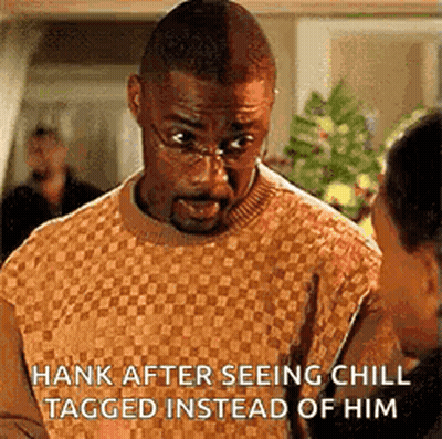 Man In Glasses And Sweater Talking To Another Man GIF