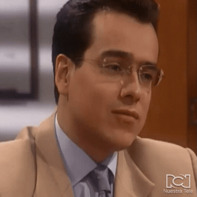 Man In Glasses And Tan Suit Nuestra Tele GIF