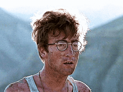 Man In Glasses And Tank Top Covered In Mud GIF