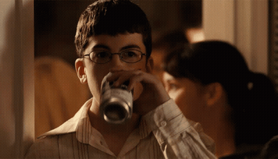 Man In Glasses And Vest In Parking Lot GIF
