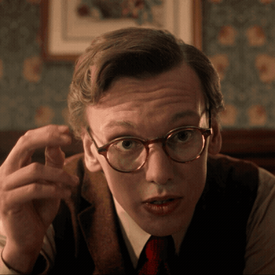 Man In Glasses And Vest Pointing GIF