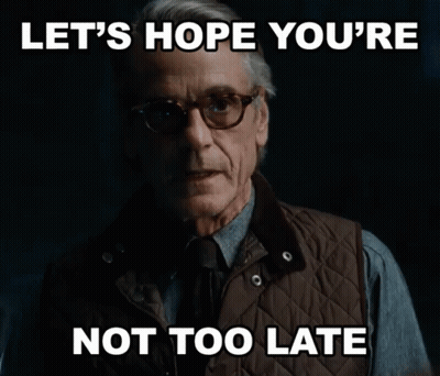 Man In Glasses And Vest Says Let's Hope You're Not Too Late GIF
