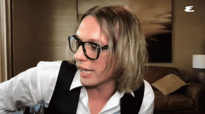 Man In Glasses And Vest With Letter E GIF
