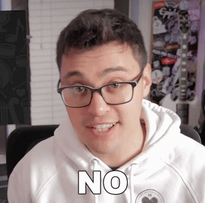 Man in Glasses and White Hoodie Saying No