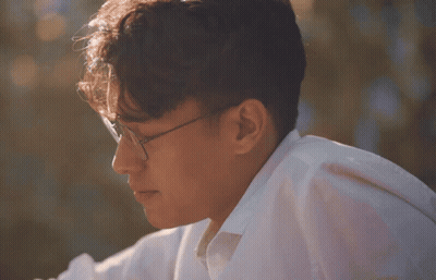 Man In Glasses And White Shirt Looking Aside GIF