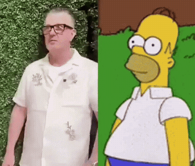 Man In Glasses And White Shirt Next To Homer Simpson GIF