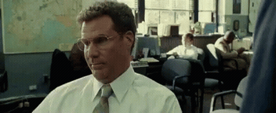 Man In Glasses And White Shirt Sitting In Office GIF
