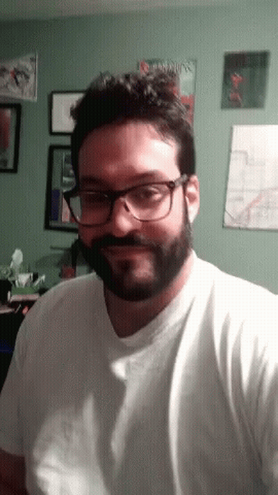 Man In Glasses And White Shirt With Book Called Tab GIF