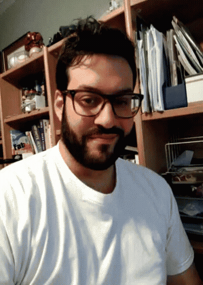 Man In Glasses And White Shirt With Book Tab GIF