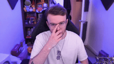 Man In Glasses And White Shirt With Chinese Writing Covering Nose GIF