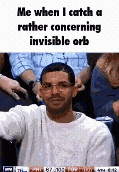 Man In Glasses And White Sweater Sitting In Crowd GIF