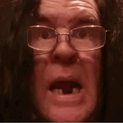 Man in Glasses and Wig Making Funny Face