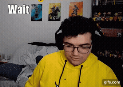 Man In Glasses And Yellow Hoodie Waiting GIF